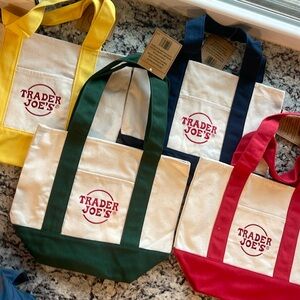 Trader Joe’s mini canvas tote bags. One of each color available